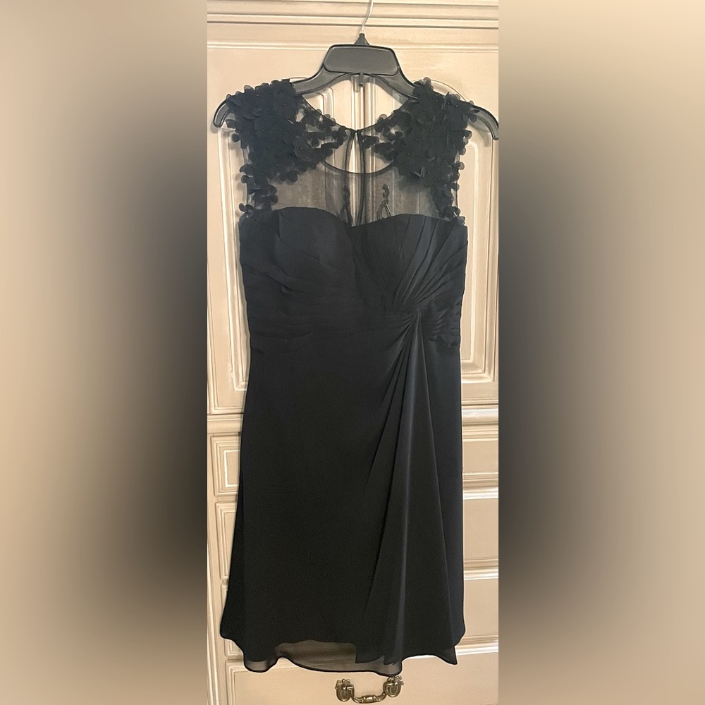Beautiful black dress with flower detail. Only worn once!